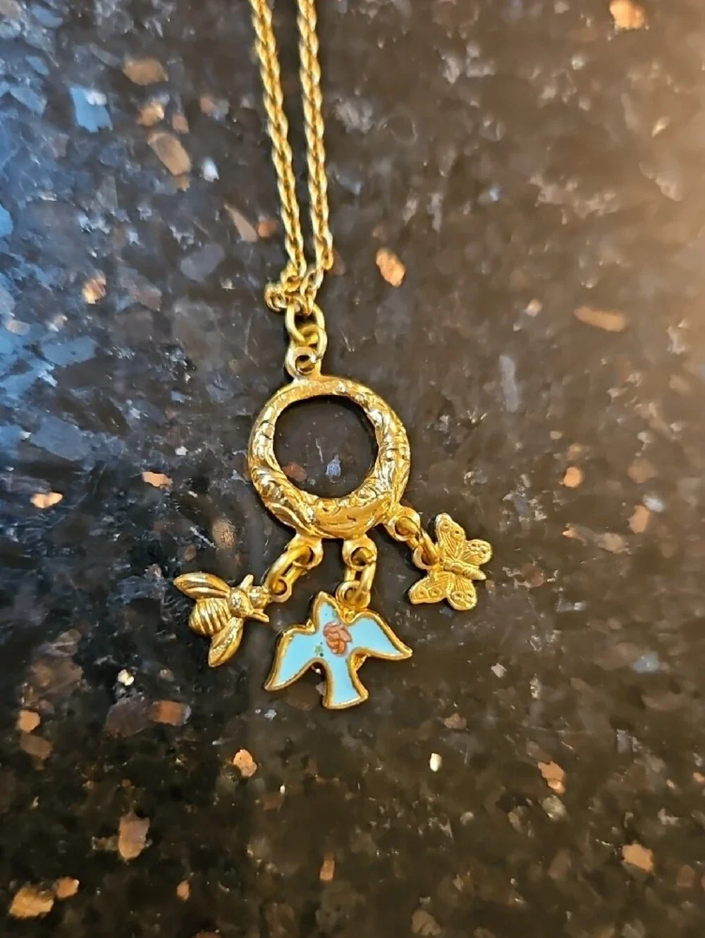 1928 Gold-Tone Circle Necklace with Blue Enamel Bird Bee Butterfly Charms